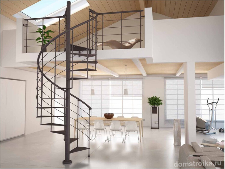Металлическая винтовая лестница позволяет освободить дополнительное пространство и делает переход на второй этаж еще более воздушным и легким
