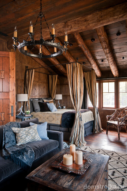 Красивая спальня-гостиная, оформленная в стиле рустика