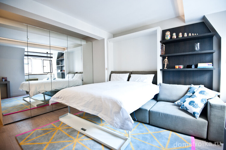 Даже дизайн спальни-гКровать-трансформер, которая прячется в стене, отлично сэкономит пространство в маленькой спальне-гостинойостиной площадью 18 кв. м может быть очень уютный и красивый