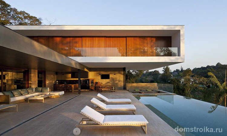 Стильный дом с бассейном в стиле модерн