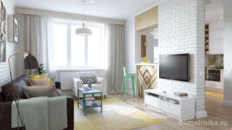 Стильный и светлый интерьер однокомнатной квартиры с имитацией кирпичной стенки