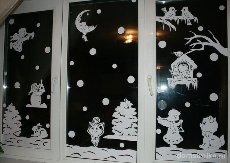 Зимний сказочный сюжет на окне с помощью трафарета